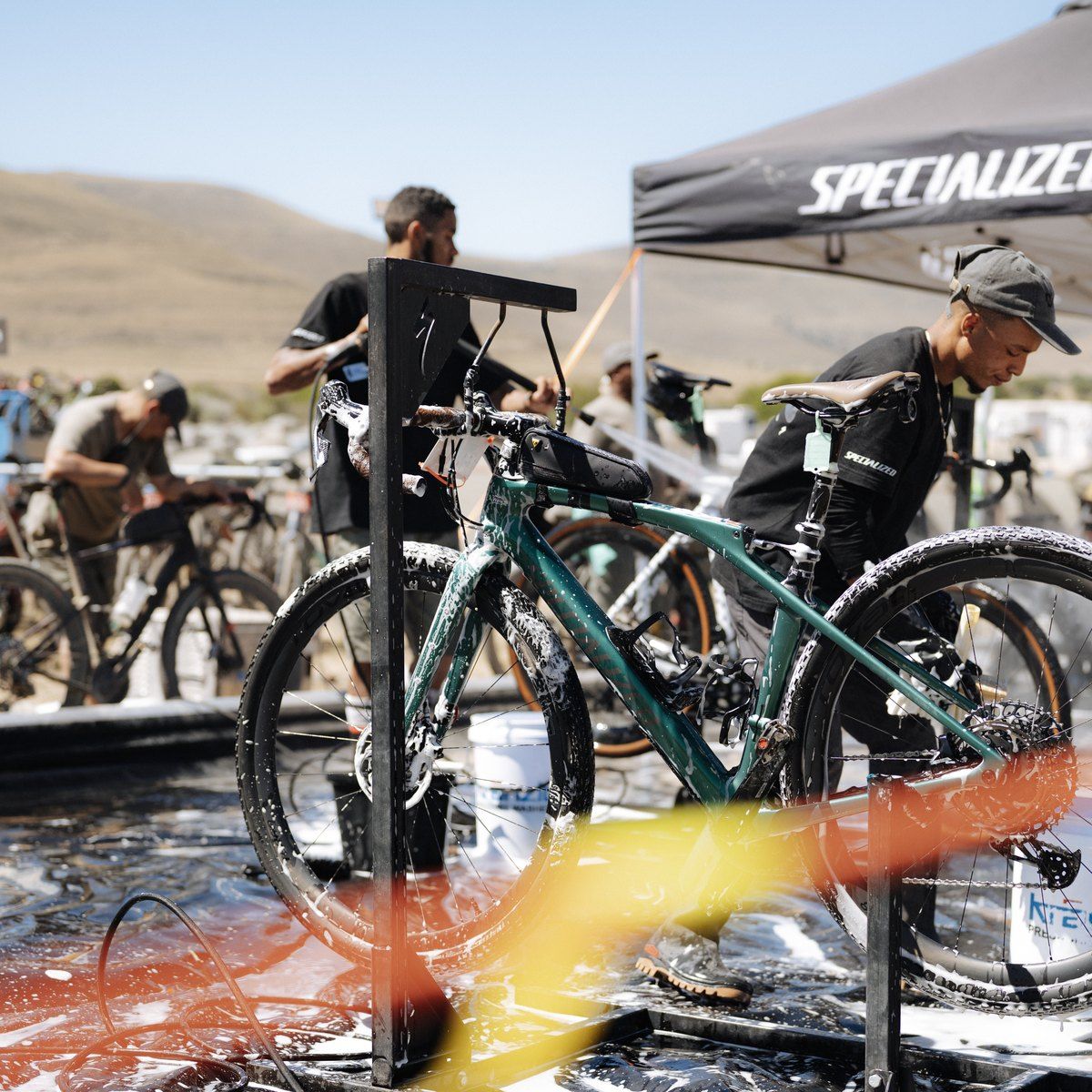 Bike wash crew cleaning riders’ bikes in the Burn Camp