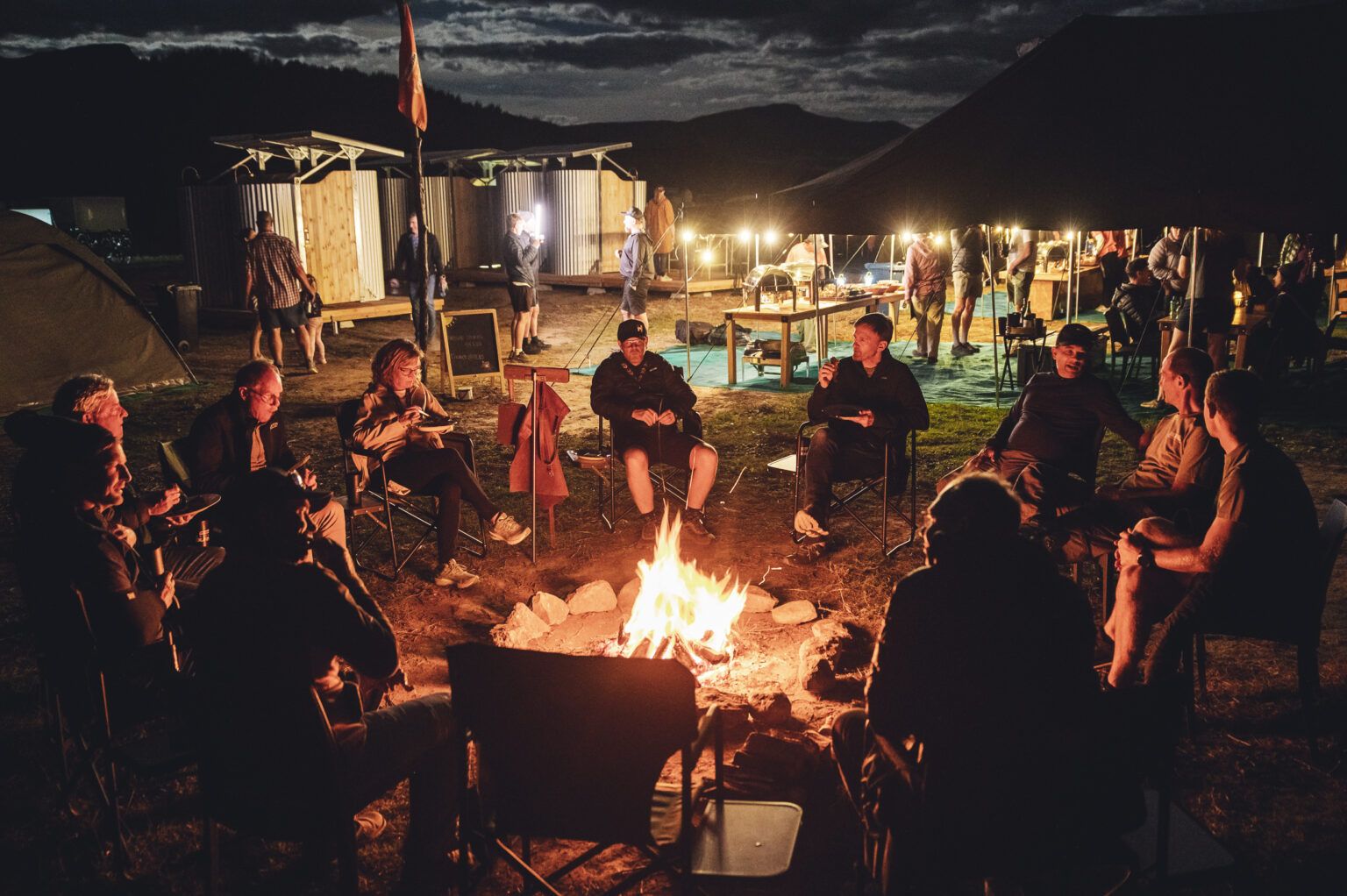Riders around the fire in a Burn Camp Lapa at night