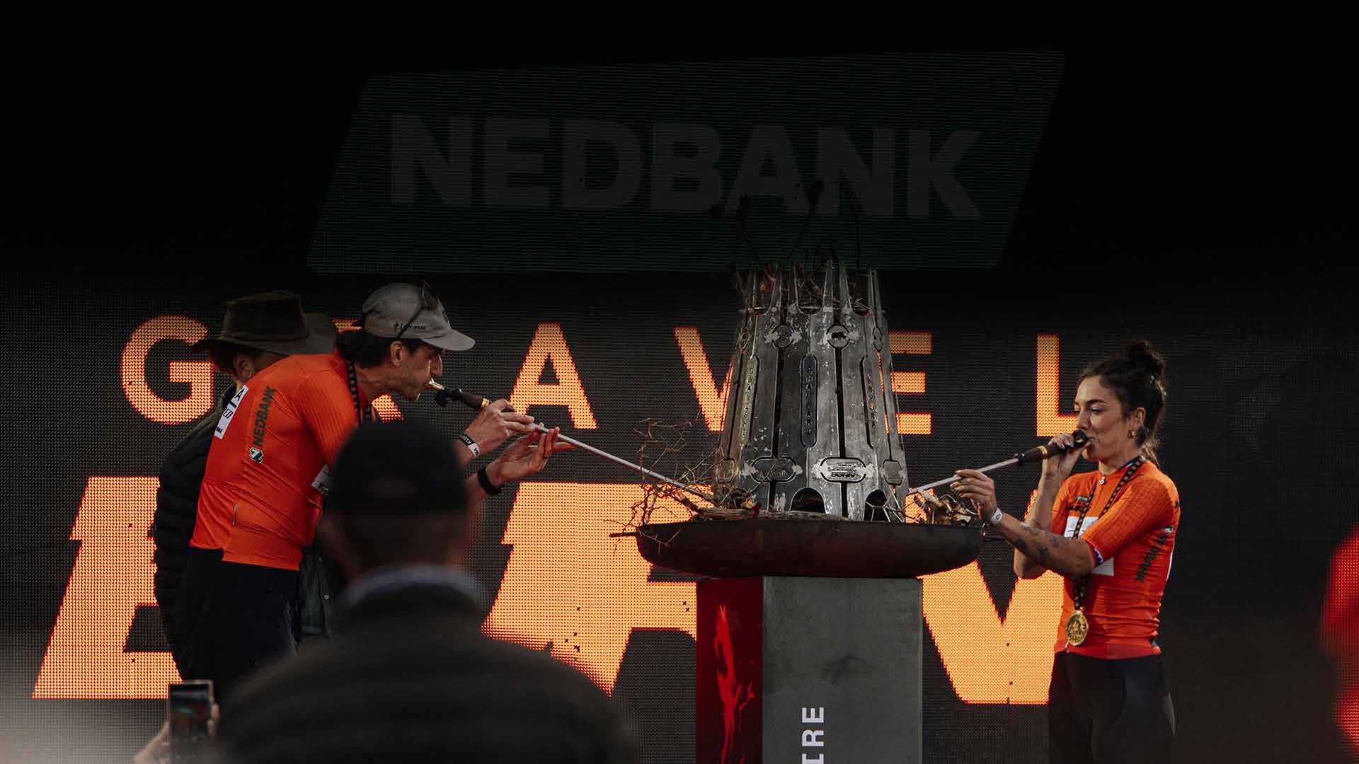 The Pro champions light the closing fire with their Fire Starter trophies